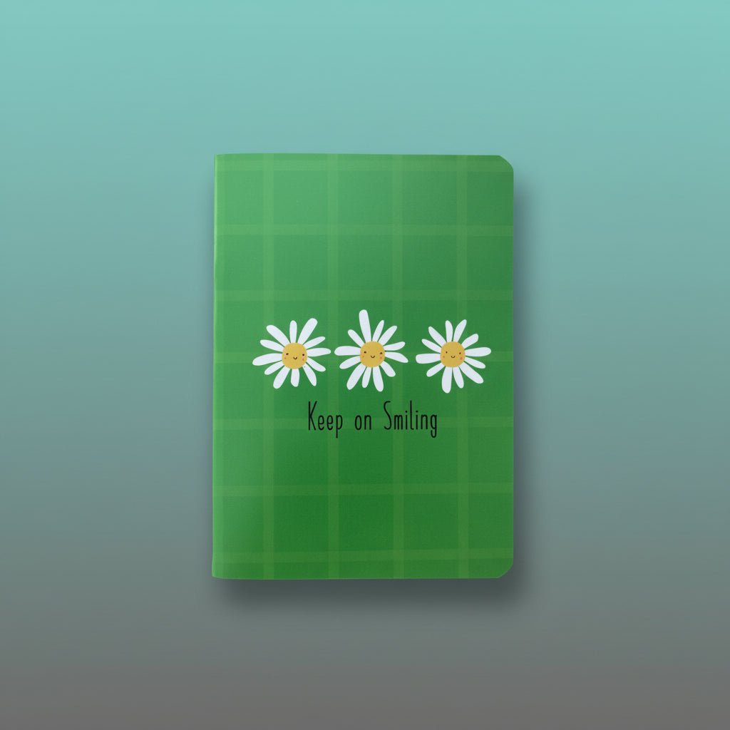 A5 Spiral Notebook - Gift Hub Mart Keep On Smiling, green cover with white daisies.