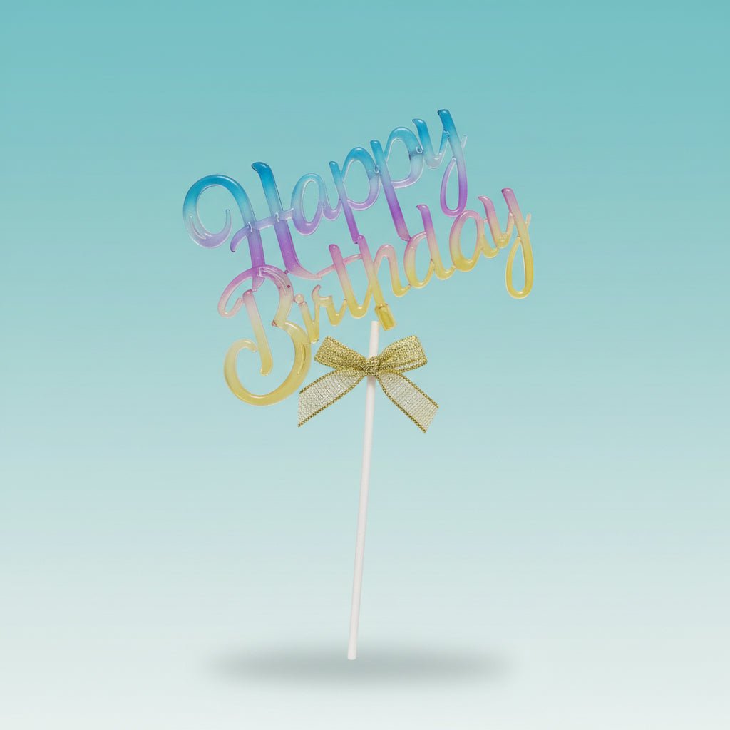 Acrylic cake topper by Gift Hub Mart in a blue-pink-yellow gradient with a gold bow