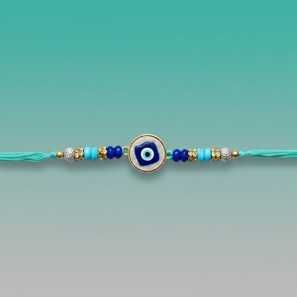 Evil Eye Teal Rakhi by Gifthubmart featuring teal thread and blue beads.