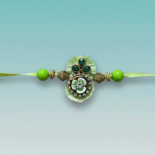 Parrot Green Bb Rakhi by Gifthubmart with green beads and ornate pendant
