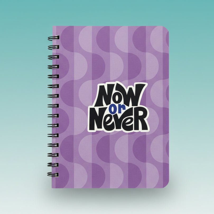A5 Notebook - Now Or Never by Sundaram, lavender purple cover.