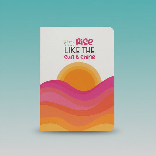A5 Spiral Notebook by Gift Hub Mart – Rise Like The Sun & Shine with sunrise motif and vibrant waves.