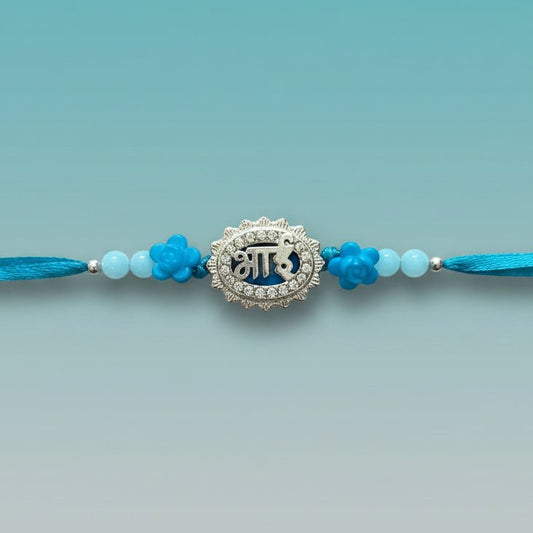 Bhai Firozi Rakhi by Gifthubmart - turquoise blue beads with silver-toned pendant