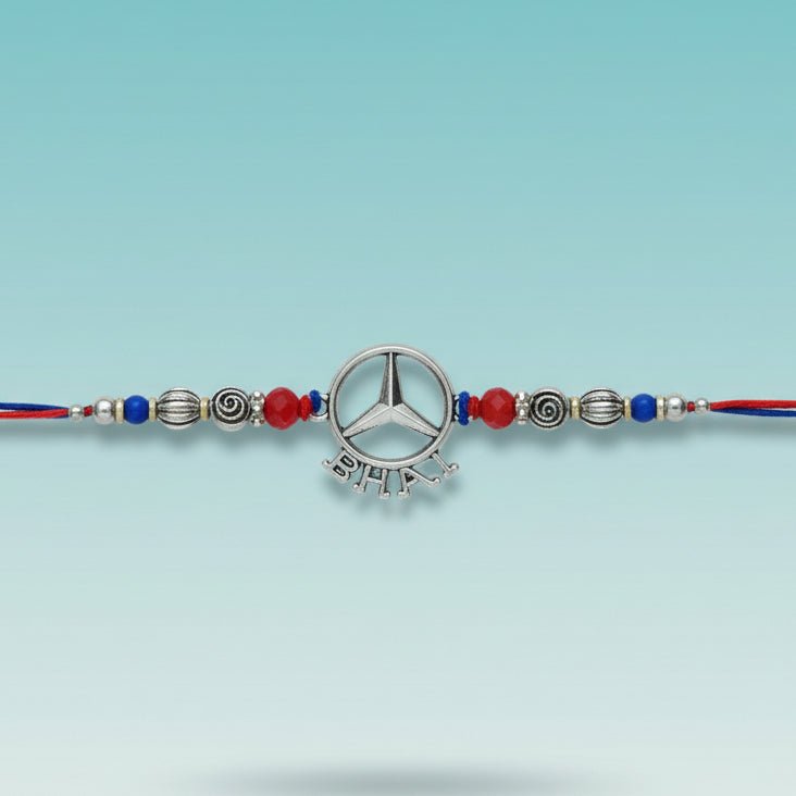 Bhai Rakhi 40F by Gifthubmart rakhi bracelet with silver pendant, beads, and red-blue thread