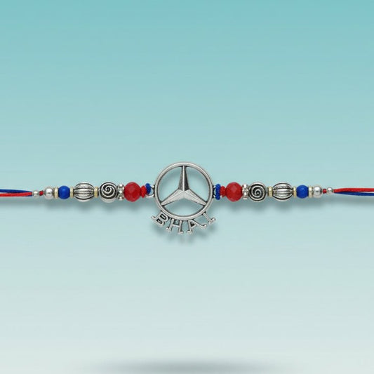 Bhai Rakhi 40F by Gifthubmart rakhi bracelet with silver pendant, beads, and red-blue thread