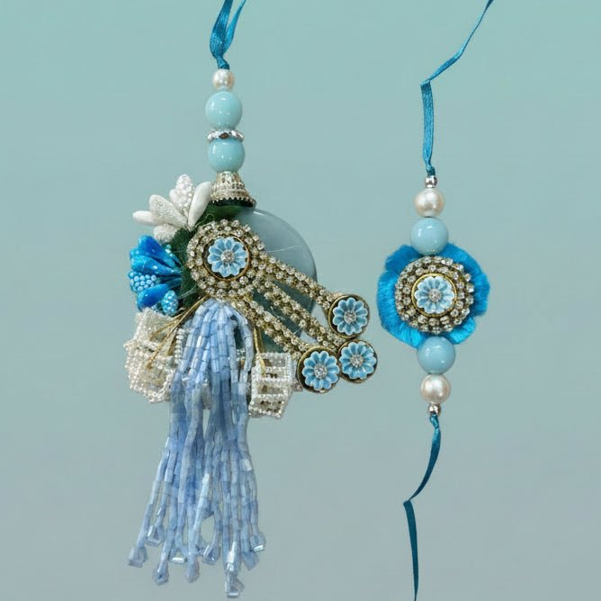 Blue Stone Bb Rakhi by Gifthubmart with turquoise beads, crystal centerpiece and blue tassel.
