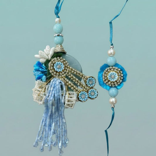Blue Stone Bb Rakhi by Gifthubmart with turquoise beads, crystal centerpiece and blue tassel.