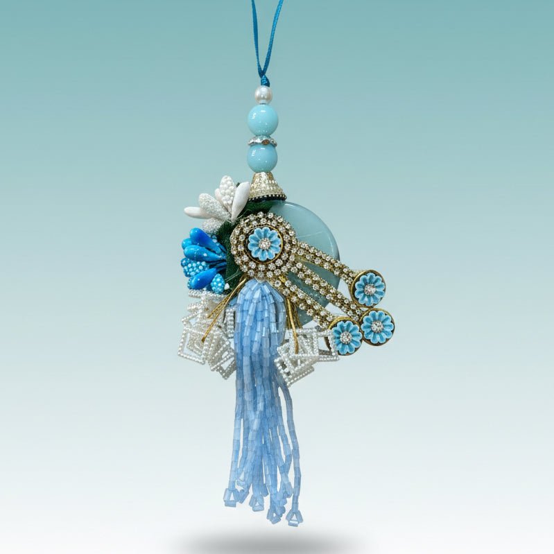 Rakhi by GiftHubmart: Blue Stone Bb Rakhi with turquoise beads and blue tassel