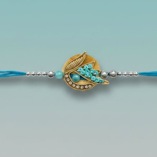 Blue Tara & Stone Rakhi from Gifthubmart with turquoise beads and crystal pendant on blue thread
