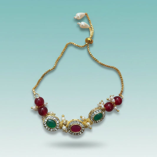 Bracelet Rakhi 3 Stones by Gifthubmart, gold-tone chain with red and green stones and pearl accents
