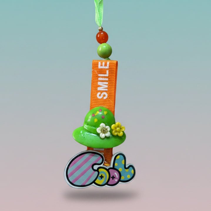 Gifthubmart Cool Rakhi Lumbi with orange and green beads, orange strap and floral embellishment