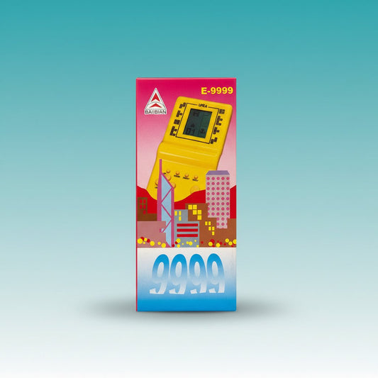 E9999 Brick Game handheld game console by Gift Hub Mart, yellow device on pink packaging