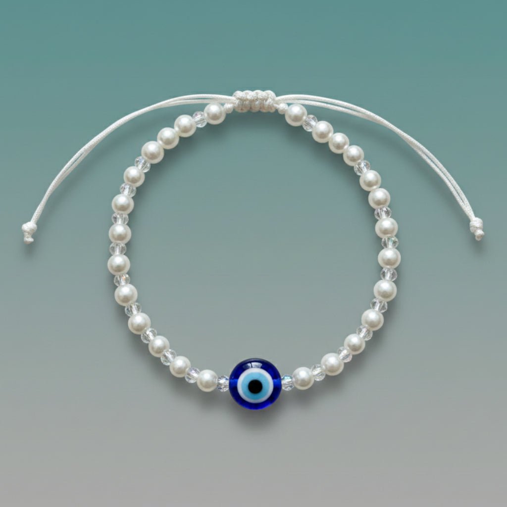 Evil Eye With Beads Bracelet featuring white faux pearls, a protective blue evil eye charm, and a white adjustable string closure.