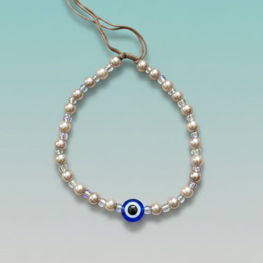 Evil Eye With Beads Bracelet featuring white faux pearls and a protective blue evil eye charm.