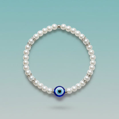 Evil Eye With Beads Bracelet featuring white faux pearls, silver-tone rhinestone spacers, and a protective blue evil eye charm.