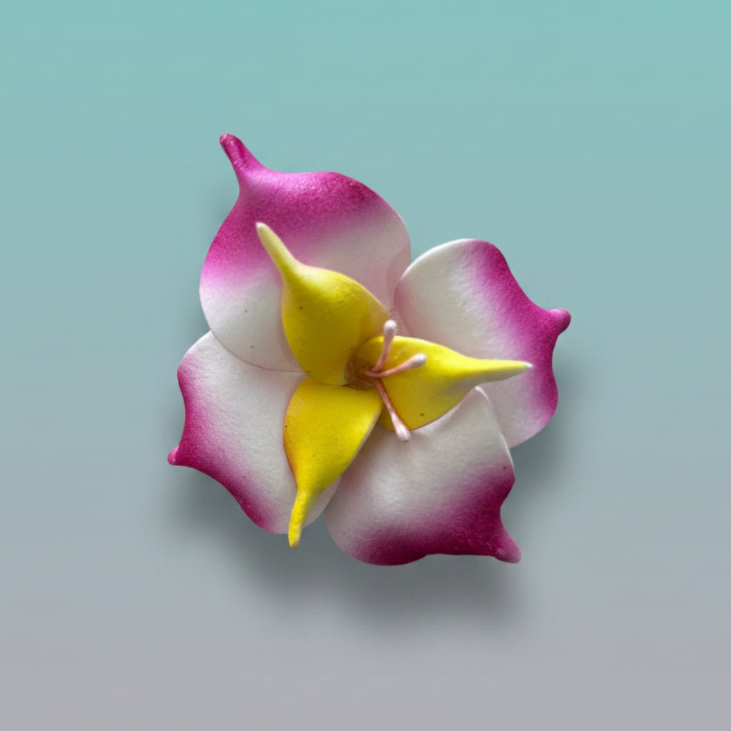 Magenta, white, and yellow 3D fabric flower rubberband hair tie.