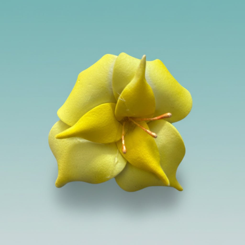 Yellow 3D fabric flower rubberband hair tie with an orange center.