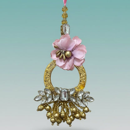 Gulab Ghunghru BB Rakhi by Gifthubmart with pink fabric flower and crystal-studded pendant