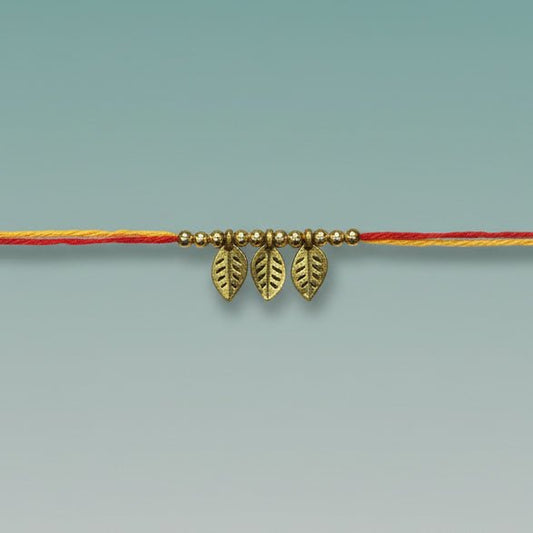 GiftHubmart Moli Rakhi Sadi on orange thread with small gold leaf charms