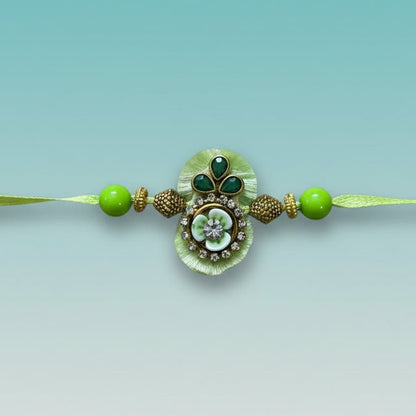 Parrot Green Bb Rakhi by Gifthubmart with green beads and ornate pendant
