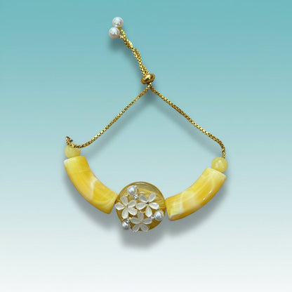 Gifthubmart Peach and Yellow Bracelet Rakhi with gold chain and pearl centerpiece