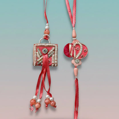 Gifthubmart Peach Purse BB Rakhi set – two peach pendants with pearl beads on red cords.