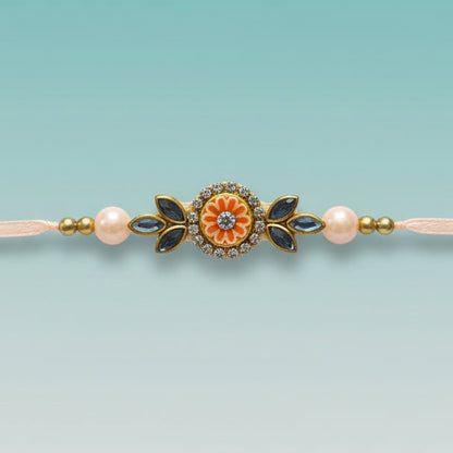 Gifthubmart Peach Small Lumba BB Rakhi with peach beads and floral centerpiece