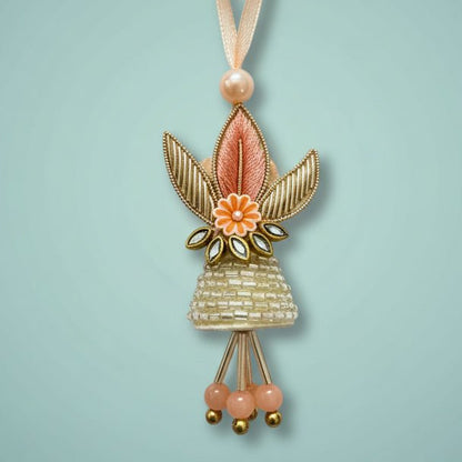 Peach Small Lumba BB Rakhi by Gifthubmart with peach ribbon and floral leaf pendant
