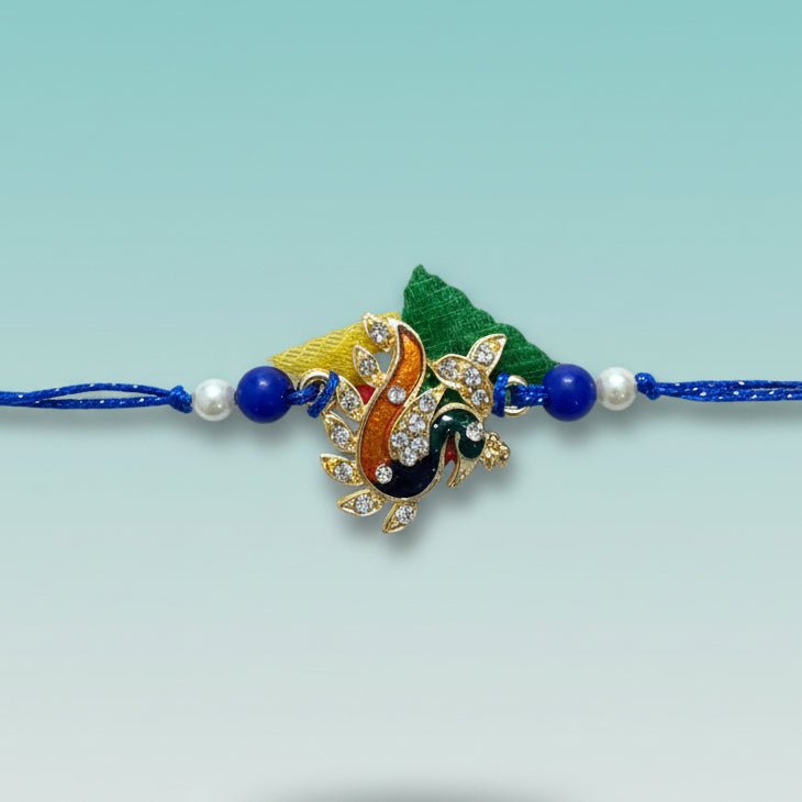 Peacock Bb Rakhi by Gifthubmart with blue thread and jeweled peacock centerpiece