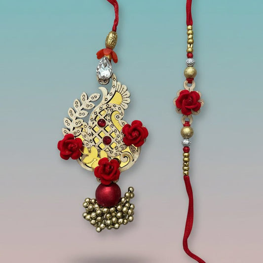 Red MDF Kairi BB Rakhi by Gifthubmart on red thread with gold beads and red floral accents