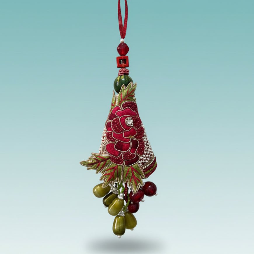 Gifthubmart Rose Bb Rakhi with red floral design, green leaves and pearl rhinestone detailing