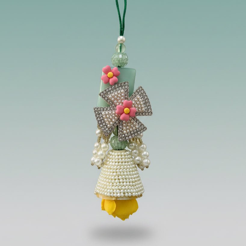 Gifthubmart White Pearls and Stones BB Rakhi with crystal bow and pink flower accent