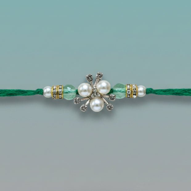 White Pearls And Stones BB Rakhi on green thread by Gifthubmart