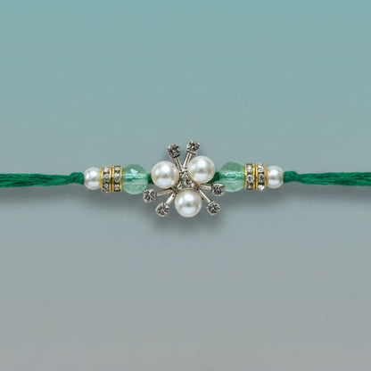 White Pearls And Stones BB Rakhi on green thread by Gifthubmart