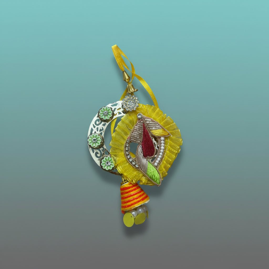 Yellow BB Rakhi by Gifthubmart with crystal-studded pendant and yellow ribbon